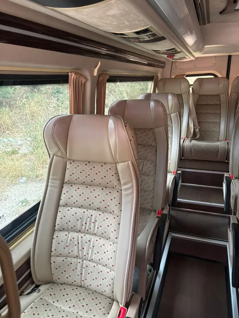 High-back beige passenger seat with patterned upholstery